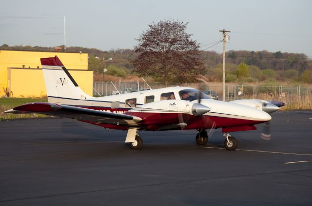 Piper Seneca (N24WE) - At the RELIANT AIR ramp. They have the lowest fuel price on the Danbury (KDXR) airport.