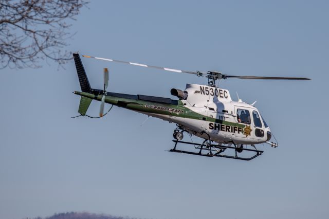 Eurocopter AS-350 AStar (N530EC) - El Dorado County Sheriff’s Airbus H125 lifts from its hanger at Placerville Airport and departs west.