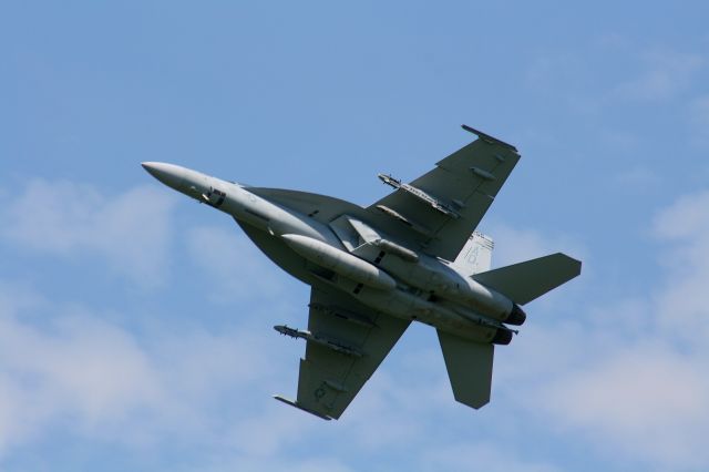 — — - An F-18E from VFA-106 Gladiators begins its turn on departure from runway 25 at KFSM.