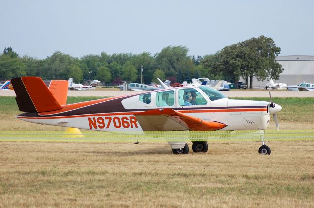 Beechcraft Bonanza (36) (N9706R) - Taxiing for departure at EAA Airventure/Oshkosh on 25 July 2012.