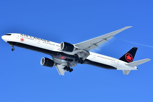 BOEING 777-300ER (C-FJZS) - Air Canada Boeing 777-333(ER) showing a bit of vapor while on approach to YYC on Feb 15.