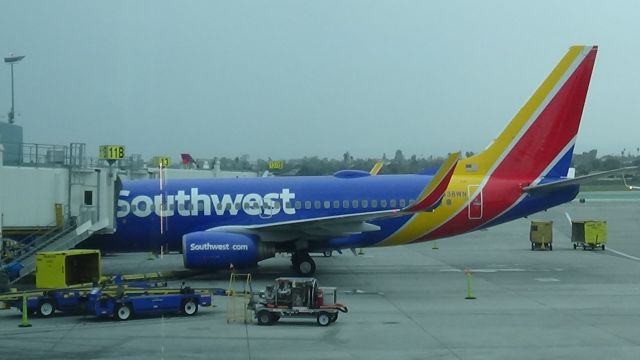 Boeing 737-700 (N438WN) - Boarding Passengers at Southwest's terminal.