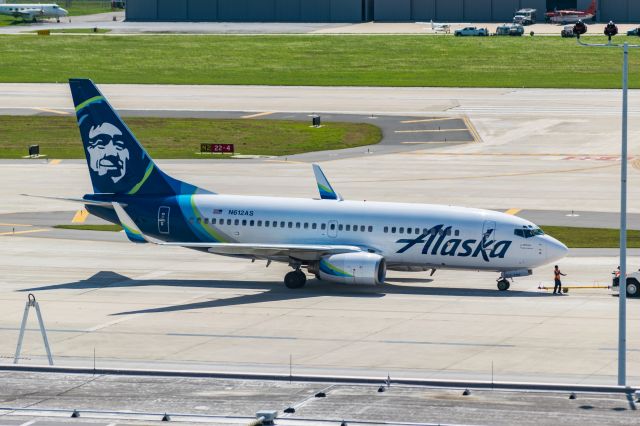 Boeing 737-700 (N612AS) - A true sign of the times.The SAT -> SEA route and vice versa is usually booked enough to consistently fill a 737-900ER to capacity. But is now empty enough to warrant sending a 737-700. Shout out to my fellow rampers who i photographed pushing the little boy out. Of course they send this rarity on my day off.