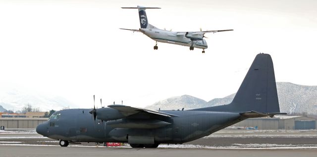 Lockheed C-130 Hercules (69-5828) - Another capture of an increasingly rare (soon to be extinct) model of C-130 Hercules, this is an MC-130P Combat Shadow (69-5828), one of just four such Hercs still in the air.  All four of the remaining Combat Shadow MC-130Ps are assigned to the Cal ANGs 129th Rescue Wing at Moffett (KNUQ).  The USAF retired its last two Combat Shadow Hercs a couple years ago, and this one, along with the other three in the California ANG, are also to be retired quite soon.br /The QXE DH8D (Dash 8) seen in the background as it is just about to land on runway 16R is Horizons  N434MK which pays tribute to "Milton G. Kuolt" by having his name on the aircraft.  (See comment below for ID info about Mr. Kuolt.)