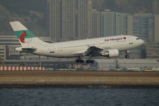 Airbus A310 (P2-ANG) - Short Final at Kai-Tak Intl Airport Rwy31 on 1991/12/15