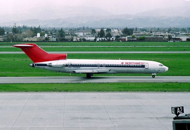 BOEING 727-200 (N728RW) - KSJC - early 1990s photo of a Northwest 727 headed to the 12R departure runway - photo from atop the parking structure.