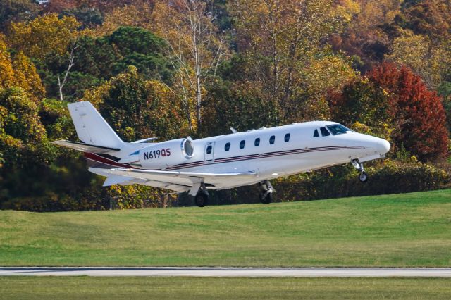 Cessna Citation Excel/XLS (N619QS) - N619QS is a 2005 Cessna Citation 560XL seen here departing Atlanta's PDK executive airport. I shot this with a Canon 100-400mm IS II lens with a focal length of 340mm. Camera settings were 1/4000 shutter, F5.6, ISO 500.  Please check out my other photography. Votes and positive comments are always appreciated. Questions about this photo can be sent to Info@FlewShots.com