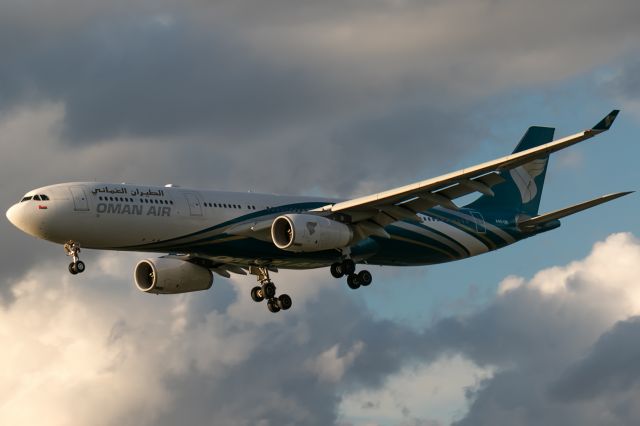 Airbus A330-300 (A4O-DB) - friendly clouds