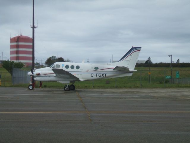 Beechcraft King Air 90 (C-FGXT) - Parked at Terminal in Yarmouth NS.Sept 12/09