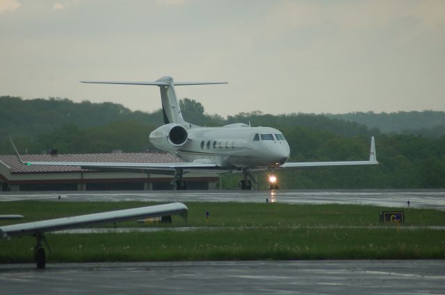 Gulfstream Aerospace Gulfstream V (N555TF) - N555TF crossing runway 36 at KOXC on a rainy afternoon