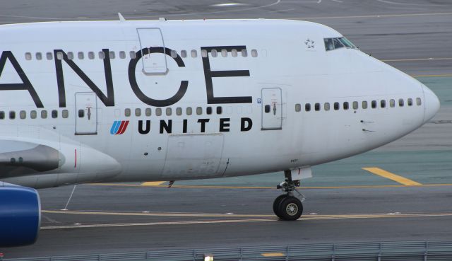 Boeing 747-400 (N121UA) - Shortly after arrival, taxiing to International G.