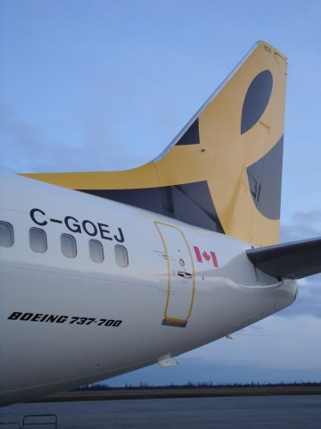 Boeing 737-700 (C-GOEJ) - Close up of EnerJets first plane...tail number 001 at the Fort McMurray Airport