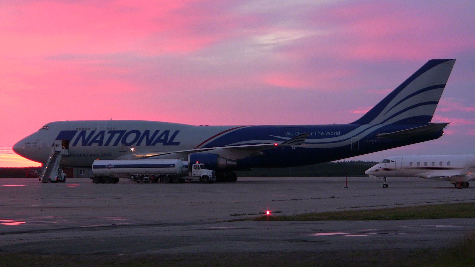 Boeing 747-400 (N952CA) - A National Airlines Boeing 747 gets refueled during the mornings first light at Gander International.