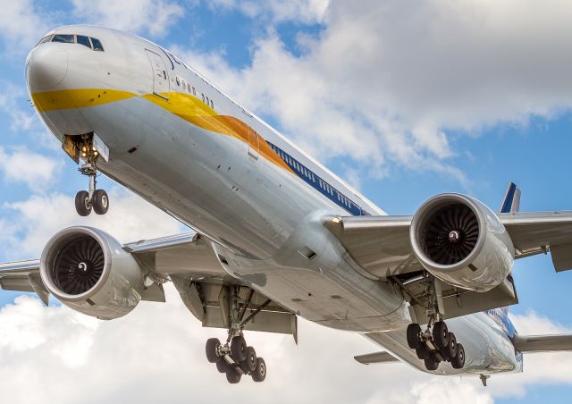 BOEING 777-300ER (VT-JEV) - JAI234 crosses Airport Road no more than 70 feet above our heads. Very short finals for runway 23 at YYZ