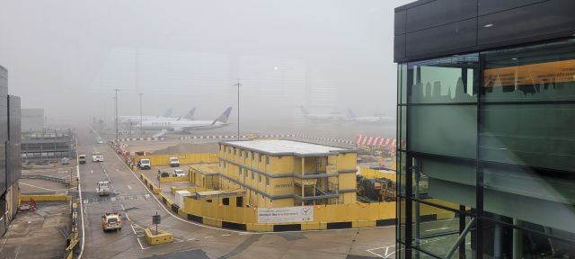 Boeing 777 — - United Airlines Boeing 777 aircraft at remote stands at London Heathrow Airport Terminal 2.