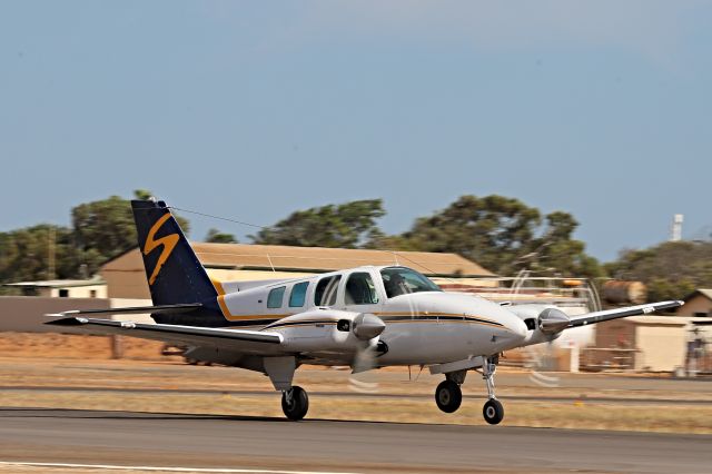 Beechcraft Baron (58) (VH-HHX) - Cross wind landing on RWY 04