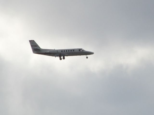 Cessna Citation II (N711NV) - On a cloudy afternoon this jet came in on 09 rather than 27 and I was able to get a shot of its approach at Carson City.