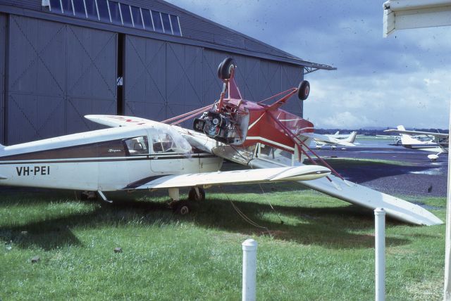 Piper Cherokee (VH-PEI) - Aircraft photo at Moorabbin in May 1974 suffering storm damage