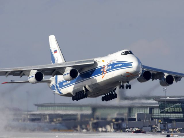 Antonov An-124 Ruslan (RNA82045) - The Russian Blizzard Maker climbing off Runway 14 on Feb 11, 2011 as flight VDA2118 to KNUQ