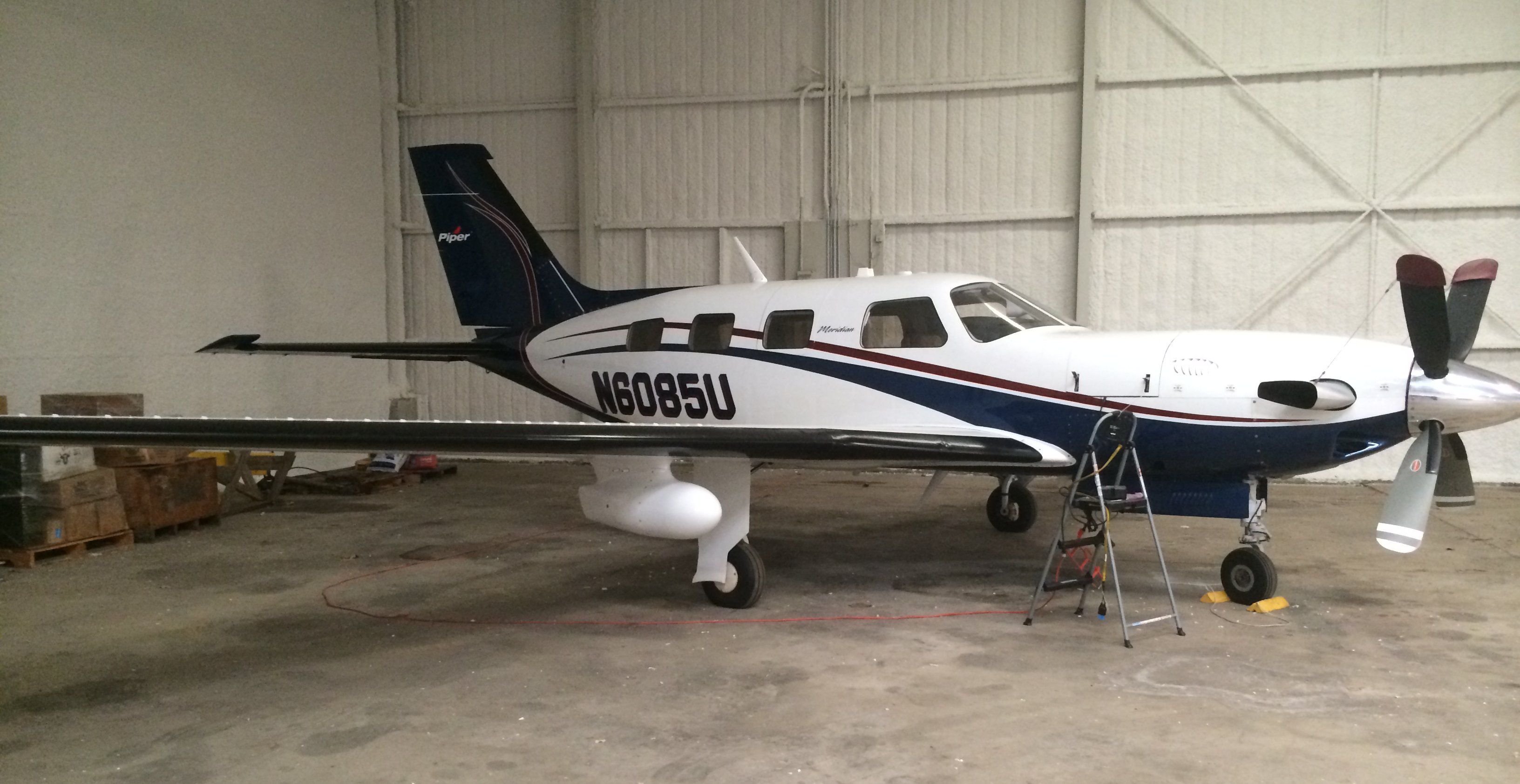 Piper Malibu Mirage (N6085U) - In the Hanger for Work.