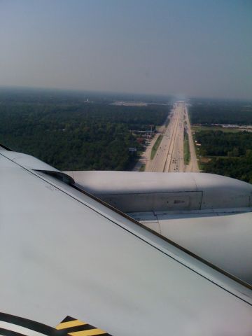 — — - Continental flight from MCO to IAH on a 737 landing on runway 26R landing from the east