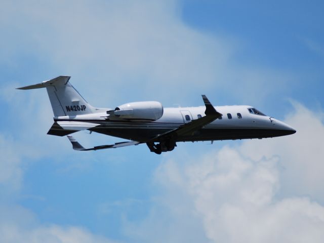 Learjet 60 (N420JP) - NASCAR driver Juan Pablo Montoya departing runway 20 at KJQF - 5/26/09