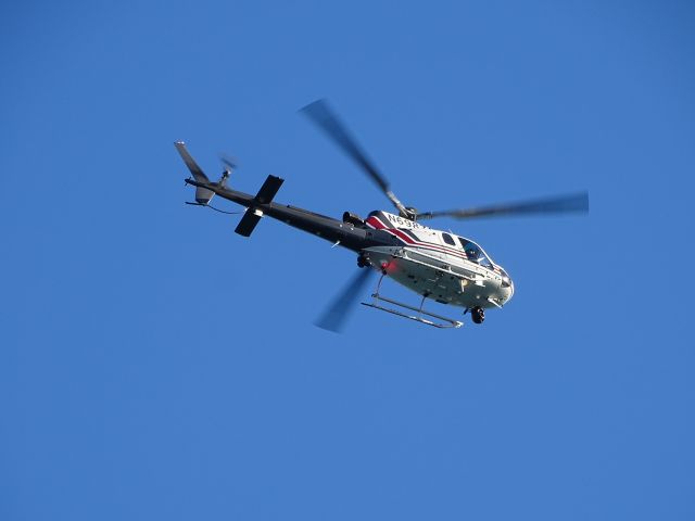 N6987A — - This helicopter was flying over Detroit, Michigan. I shot this picture while standing on the Central (Miller) Parking Garage on June 26, 2017 while attending an event for the Ford Fireworks.