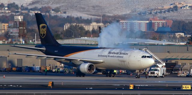 Airbus A300F4-600 (N161UP) - Had to reach way across from the east side perimeter to catch this morning shot of UPSs N161UP, an A306, getting a deicing bath prior to departing Reno.br /The cargo birds are beginning to flock here.  Yesterday morning, instead of our normal three or four aircraft on the cargo ramp, we had eight, including three heavies.  Last year, on one of the evenings I was spotting during the December holiday shipping rush, we had thirteen on the ramp at the same time and five of those were MD and Airbus big birds.  Im hoping to get a 14-bird capture next month.  