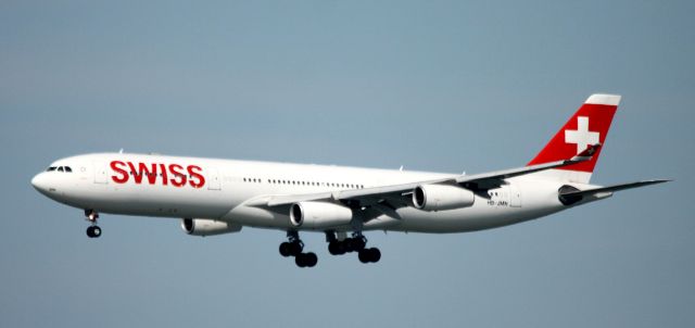 Airbus A340-300 (HB-JMN) - On Final to 28L, Over water  08-23-2015