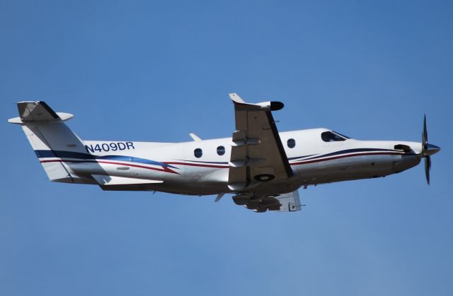 Pilatus PC-12 (N409DR) - COLLETT TRANSPORTATION LLC departing runway 2 at KJQF - 2/15/11