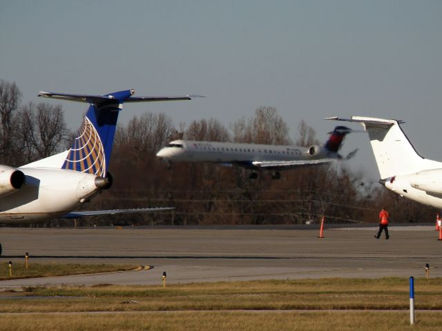 Canadair Regional Jet CRJ-900 (N161PQ) - Flagship 5828 (N161PQ) is blurred in the exhaust from   Jetlink 2405(N13992) as she lands at KLEX...