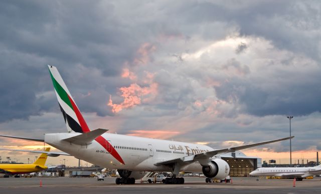 BOEING 777-200LR (A6-EWJ) - Stormy sunset in Boston