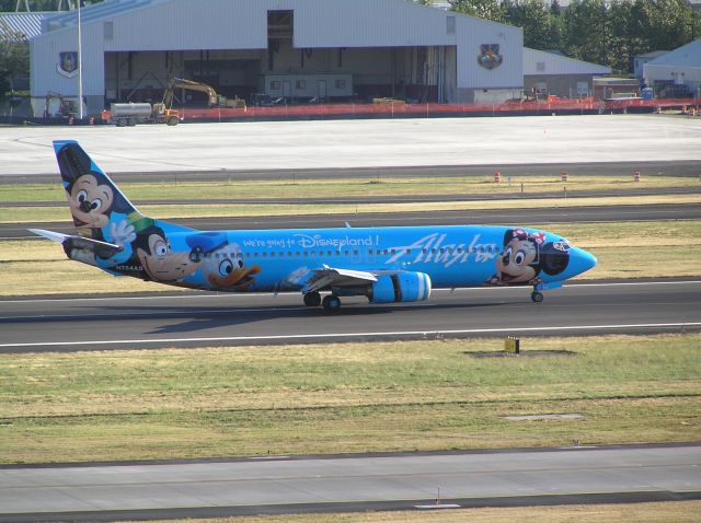 Boeing 737-700 (N784AS) - Upper level of parking garage between N and S runway complexes; 2005-07-18 ~ 1900 PDT