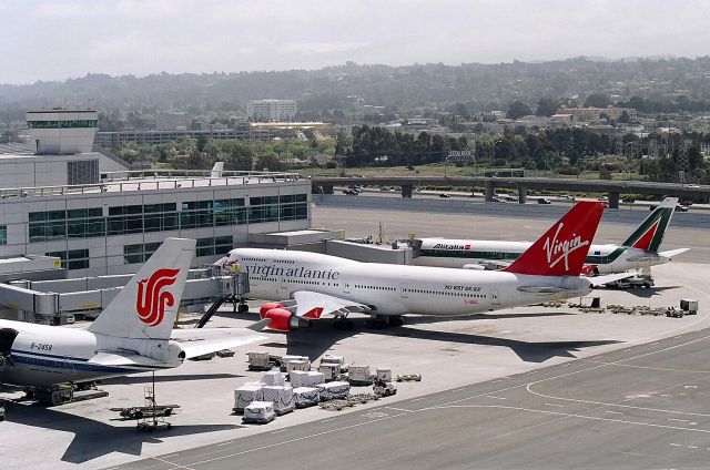 Boeing 747-400 (G-VBIG) - KSFO - south complex of the new Intl Terminal mid 2000 - top floor of the parking lot view south-southwest.