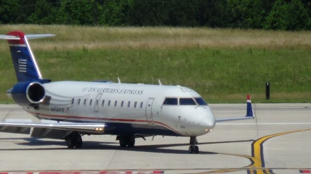 Canadair Regional Jet CRJ-200 (N458AW) - U.S. Airways (Air Wisconsin) 4237 arriving from Washington Reagan National 12:48 P.M..   Taken June 7, 2015.  