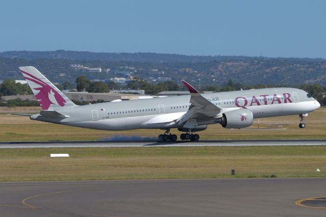 Airbus A350-900 (A7-AMK) - Feb 5 2020. Taken from inside the terminal, landing on runway 23.