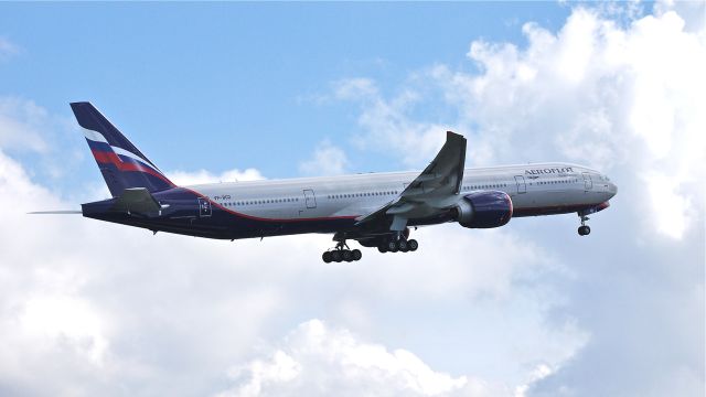 BOEING 777-300 (VP-BGD) - AFL7607 climbs from runway 16R beginning its delivery flight to UUEE / SVO on 3/28/13. (LN:1084 cn 41681).