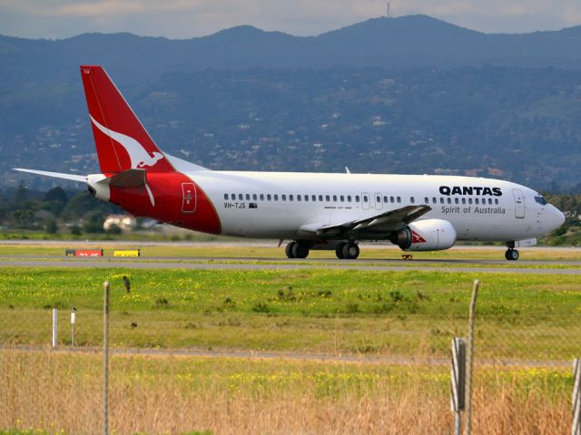 BOEING 737-400 (VH-TJS) - On taxi-way heading for take off on runway 05. Thursday 12th July 2012.