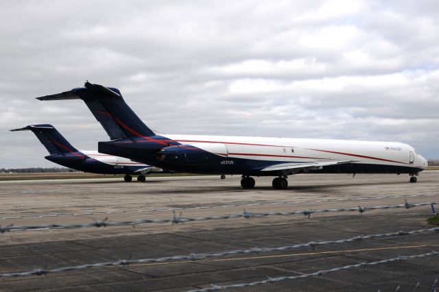 McDonnell Douglas MD-83 (N831US) - 1989 build Mad Dog. Company DC-9-33F N327US parked behind it. First pic of this bird in new colors on data base.