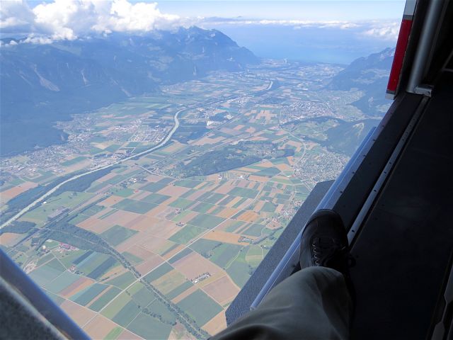 Pilatus PC-6B Turbo-Porter (HB-FLI) - Open door of the PC-6 Pilatus Porter looking down at the Rhone Valley