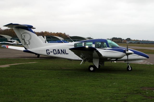 Beechcraft Duchess (G-DANL) - Parking on the grass after a local flight on 17-Nov-20.