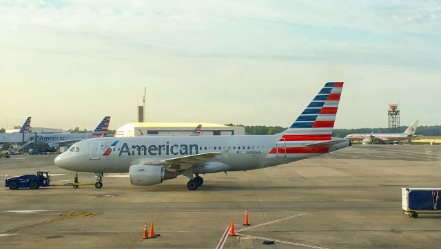 Airbus A319 (N755US) - You can see one of the last American 757s with the old livery in the background.