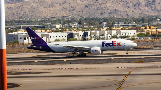 BOEING 777-200LR (N853FD) - FedEx 777-200F landing at PHX on 7/1/22. Taken with a Canon 850D and Rokinon 135mm f/2 lens. 