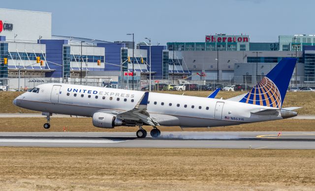 Embraer 170/175 (N86316) - ASH6156 arrives from Houston and lays some rubber down on runway 33L at YYZ