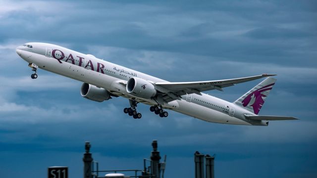 BOEING 777-300ER (A7-BED) - Qatar B77W rocketing out of a moody, overcast KSEA for the 14-hour flight to Doha.