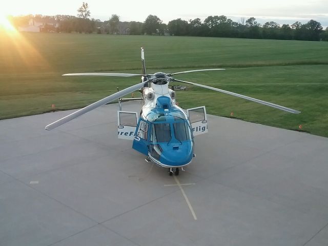 VOUGHT SA-366 Panther 800 (N520CF) - Sun sets on another day for Miami Valley Care Flight helicopter at Warren Co. airport, Ohio.