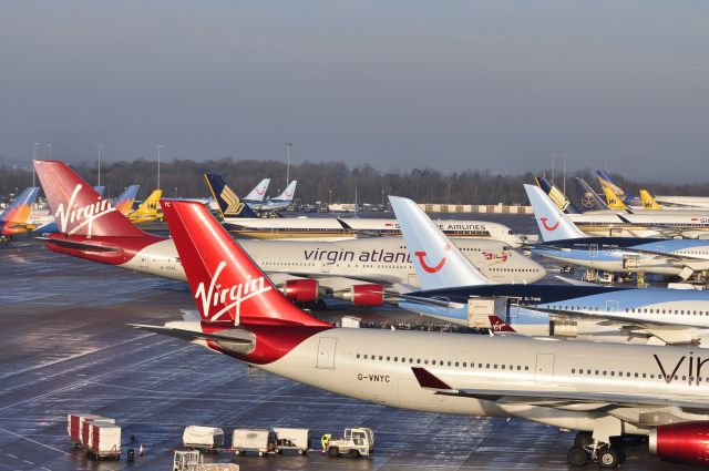 G-VGAL — - Jersey Girl pushing back from a busy T2 . A line up that will be missed at Manchester . Includes Monarch &amp; Shaheen in there. Taken off T1multi storey car park