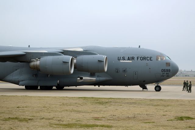 Boeing Globemaster III (93-0599) - A very early model C-17. A quick stop in  by this "MOOSE" crew, on a very overcast and cloudy January day. 2013. 