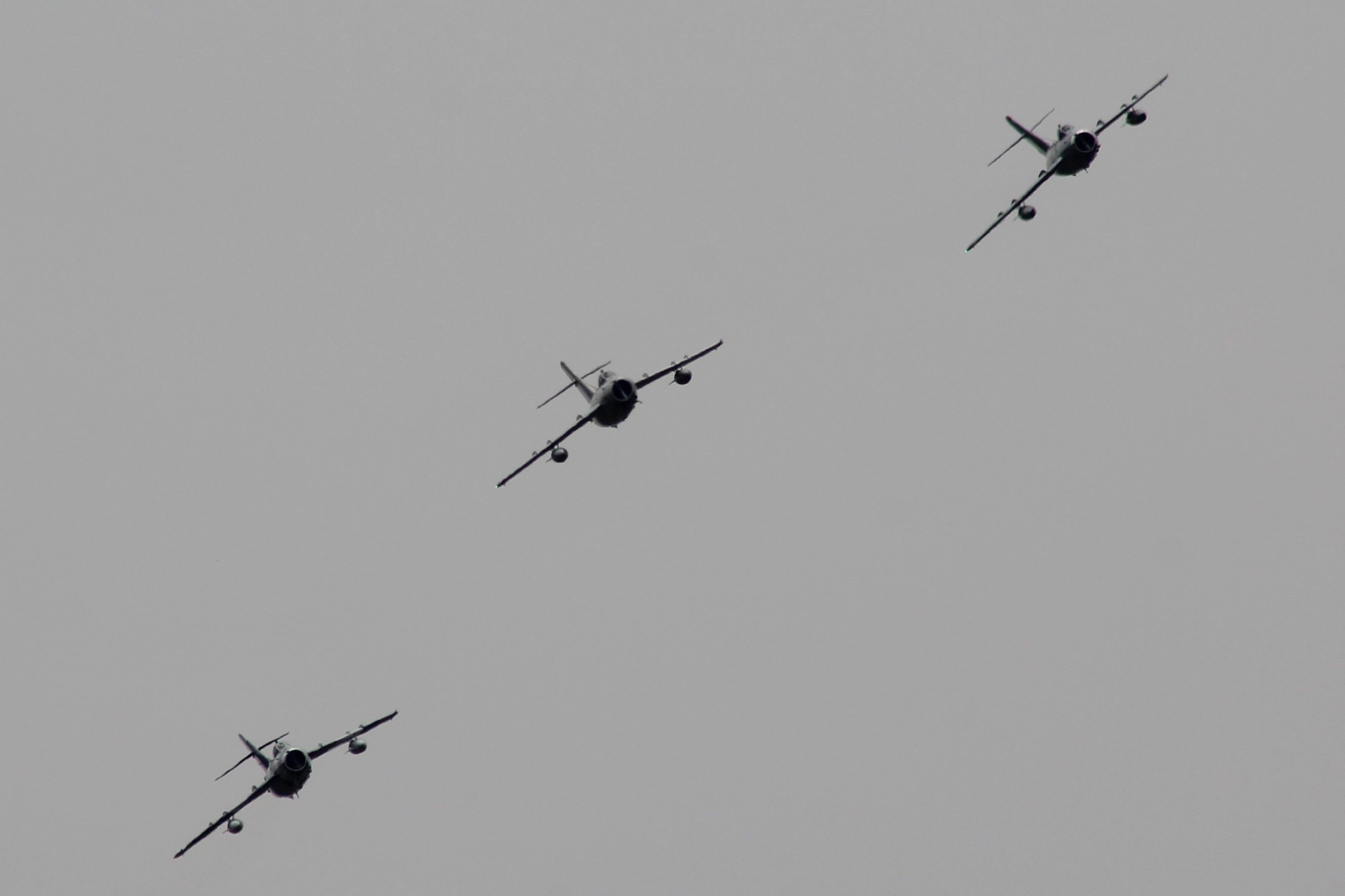 MIKOYAN MiG-17 (NX917F) - Formation of Mig 17's flying below a sky shrouded with Canadian forest fire smoke.  