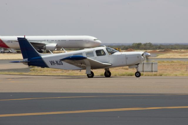 Piper Saratoga (VH-NJS) - Taxiing to RWY 12 via GA YBAS Alice Springs